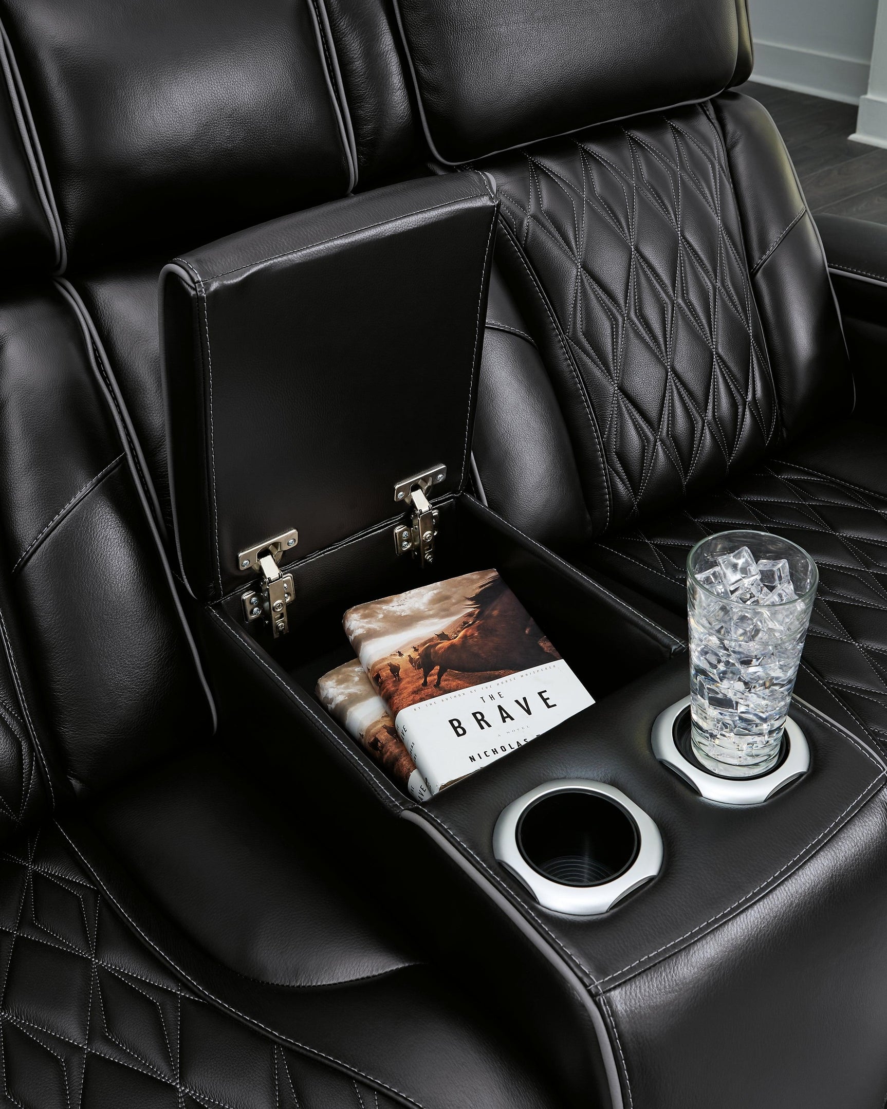 Extended ottoman of the Black Leather Loveseat