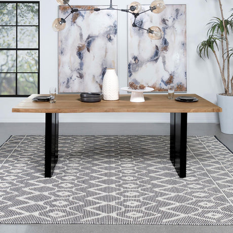 Black iron double pedestal legs under rectangular acacia wood dining table