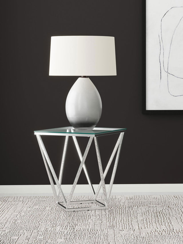 Close-up of Brittania nickel geometric metal base and glass top