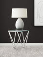 Close-up of Brittania nickel geometric metal base and glass top