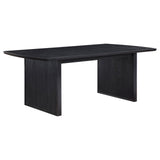 Close-up of wire-brushed distressed black wood finish on table surface
