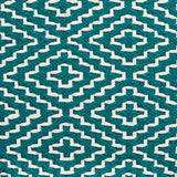 Lifestyle image of Brynnsen teal and ivory pouf in living room