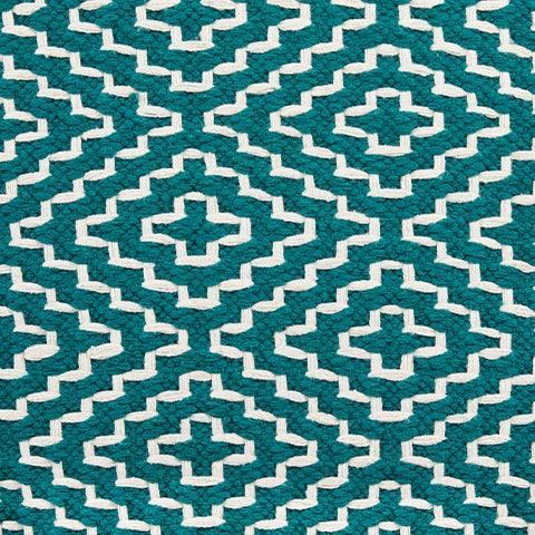 Lifestyle image of Brynnsen teal and ivory pouf in living room
