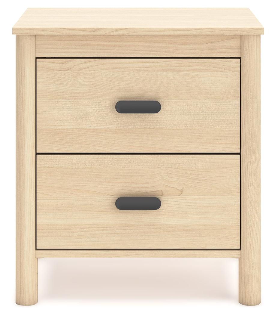 Cabinella Tan Nightstand placed in bedroom setting