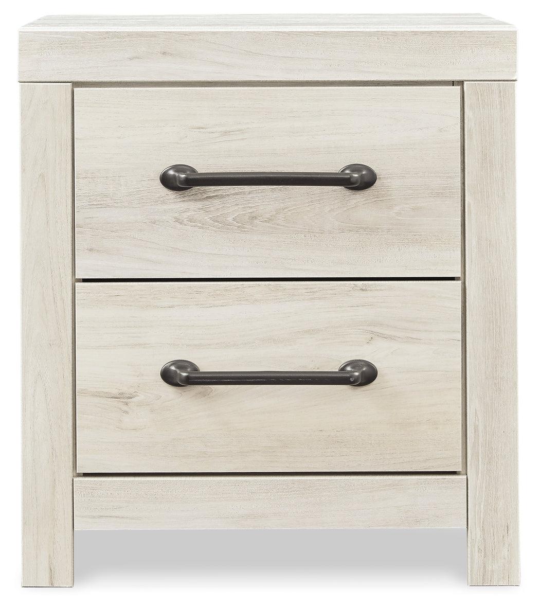 Bedroom view highlighting chest and nightstand