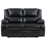Close-up of black leatherette upholstery and padded armrest