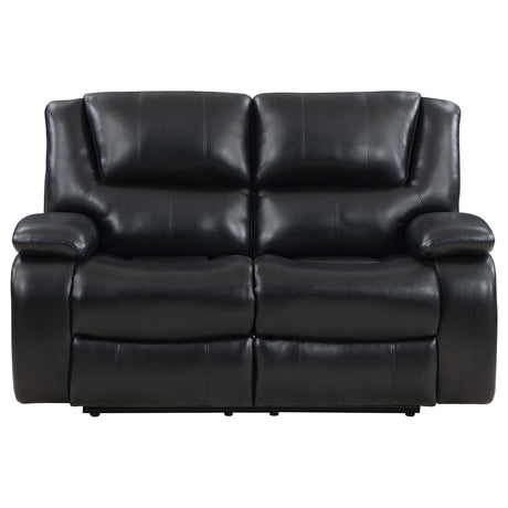 Close-up of black leatherette upholstery and padded armrest