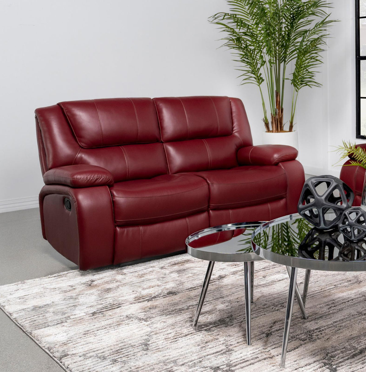 Camila loveseat showing manual recliner button on side