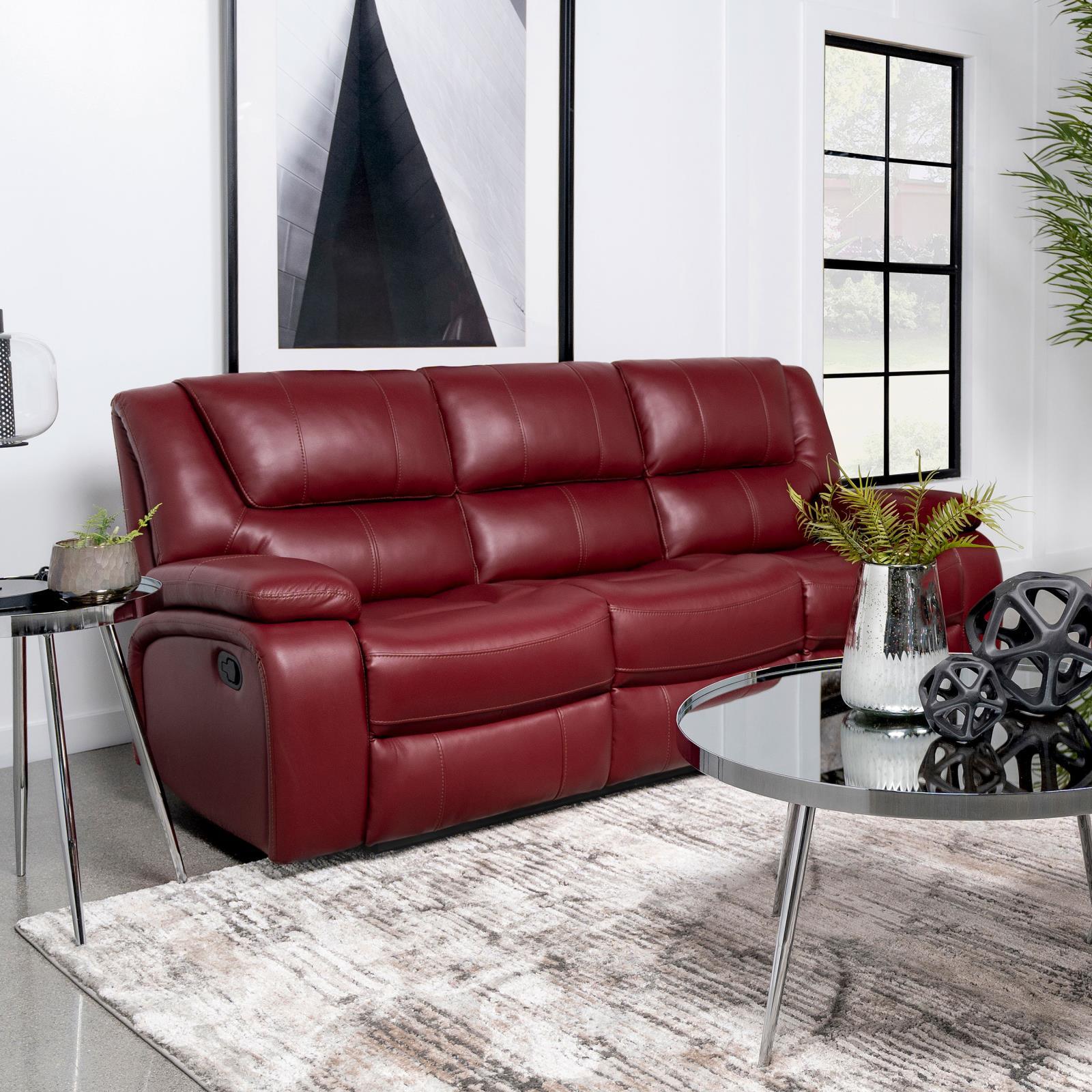 Camila red upholstered motion reclining sofa in faux leather side view