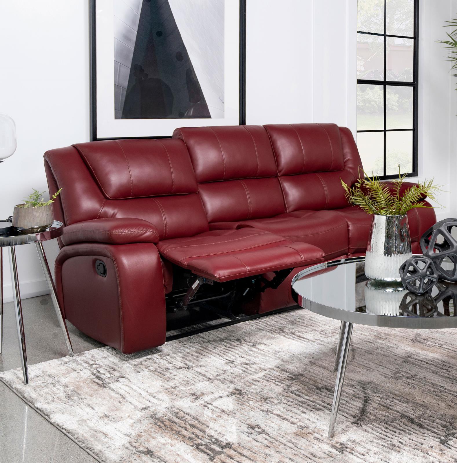 Camila red upholstered motion reclining sofa showing manual recline button