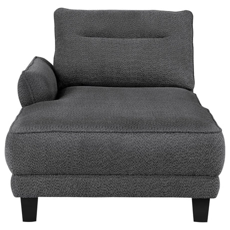 Side profile of grey upholstered sectional sofa