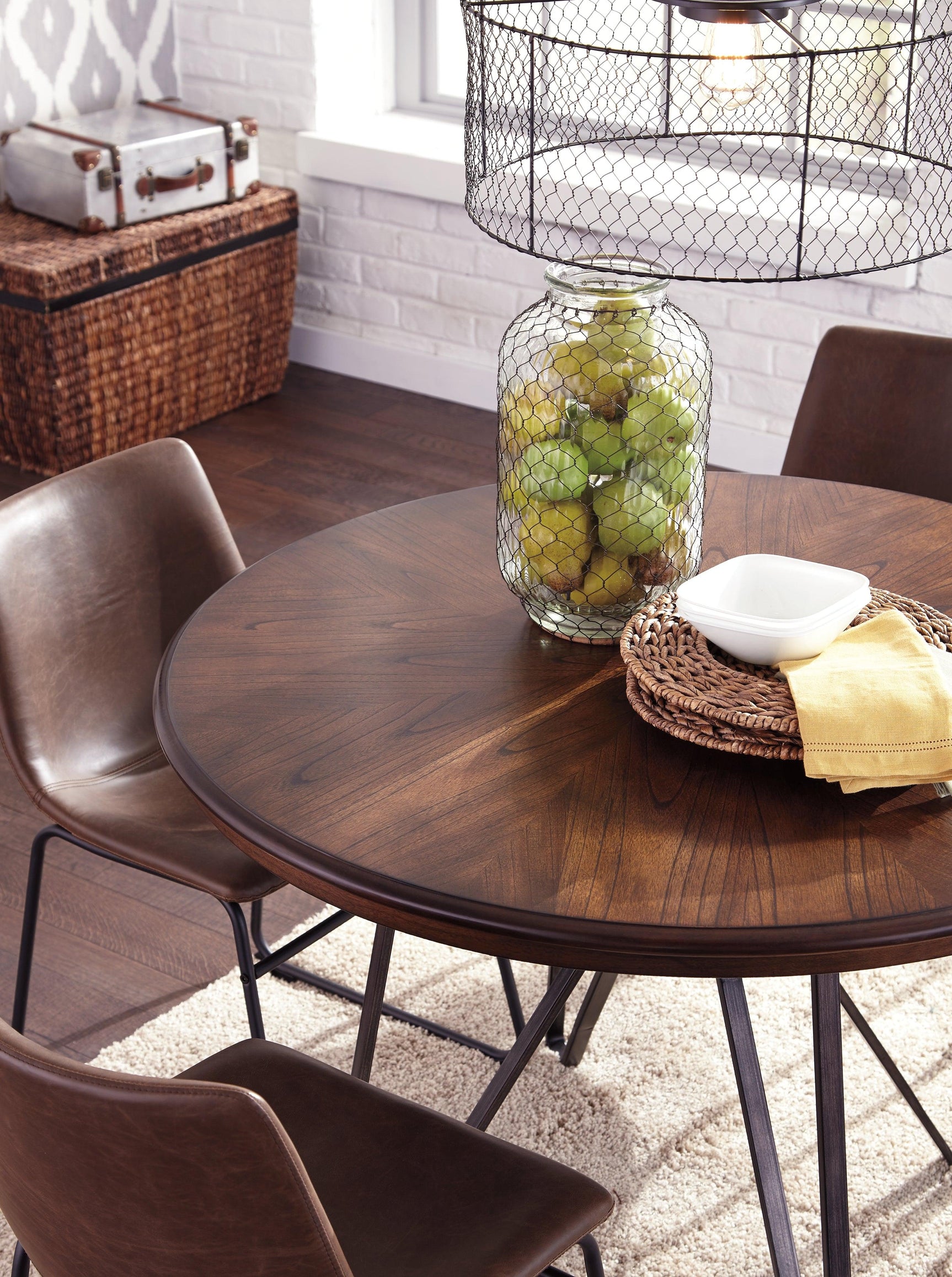 Close-up detail of the metallic base and upholstery on Centiar Dining Room Set