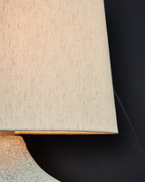 Chadrich table lamp with lit beige fabric shade
