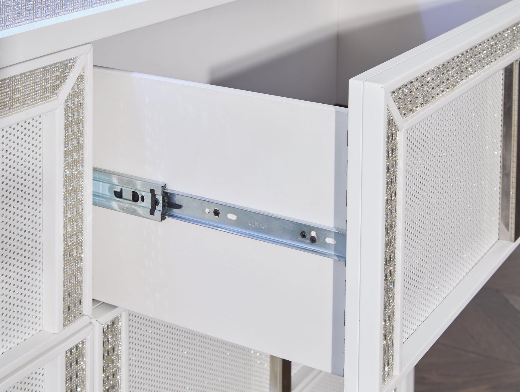 Fully closed Chalanna White Dresser in contemporary bedroom setting