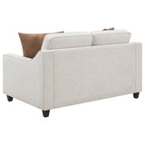 Side angle showing armrest of Christine beige sofa