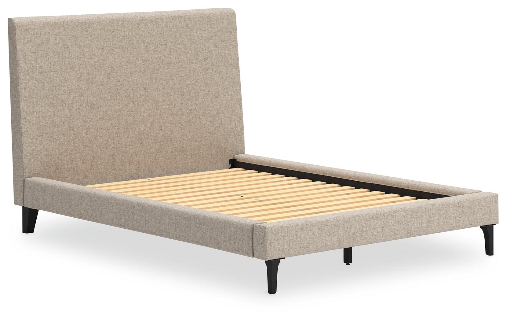 Close-up of soft gray upholstered headboard of Cielden Full Bed
