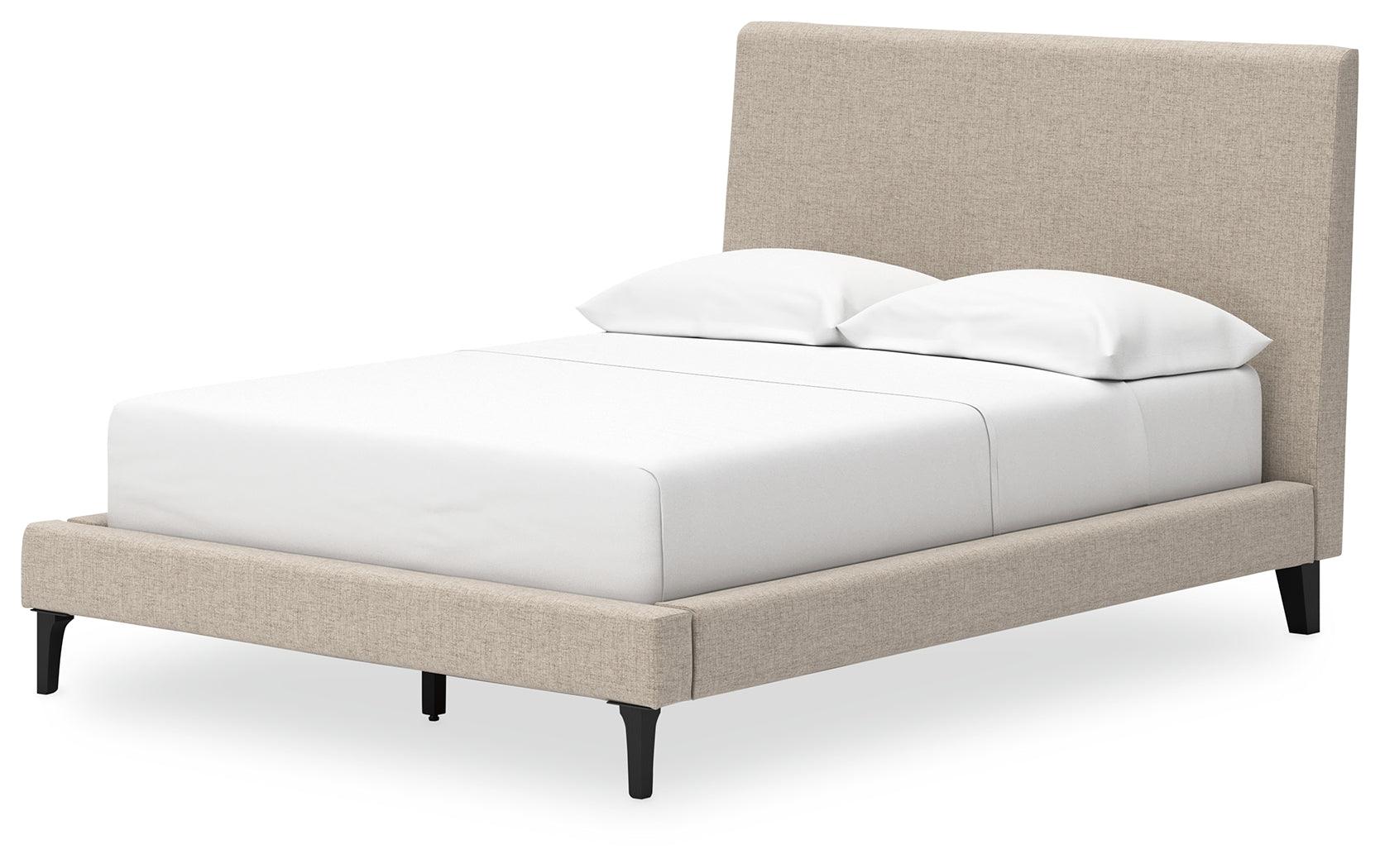 Side view of Cielden Full Upholstered Bed showing roll slats