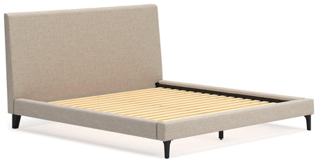 Close-up of soft gray polyester upholstery on Cielden bed