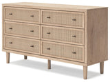 Textured beige cane-look drawer fronts of Cielden dresser