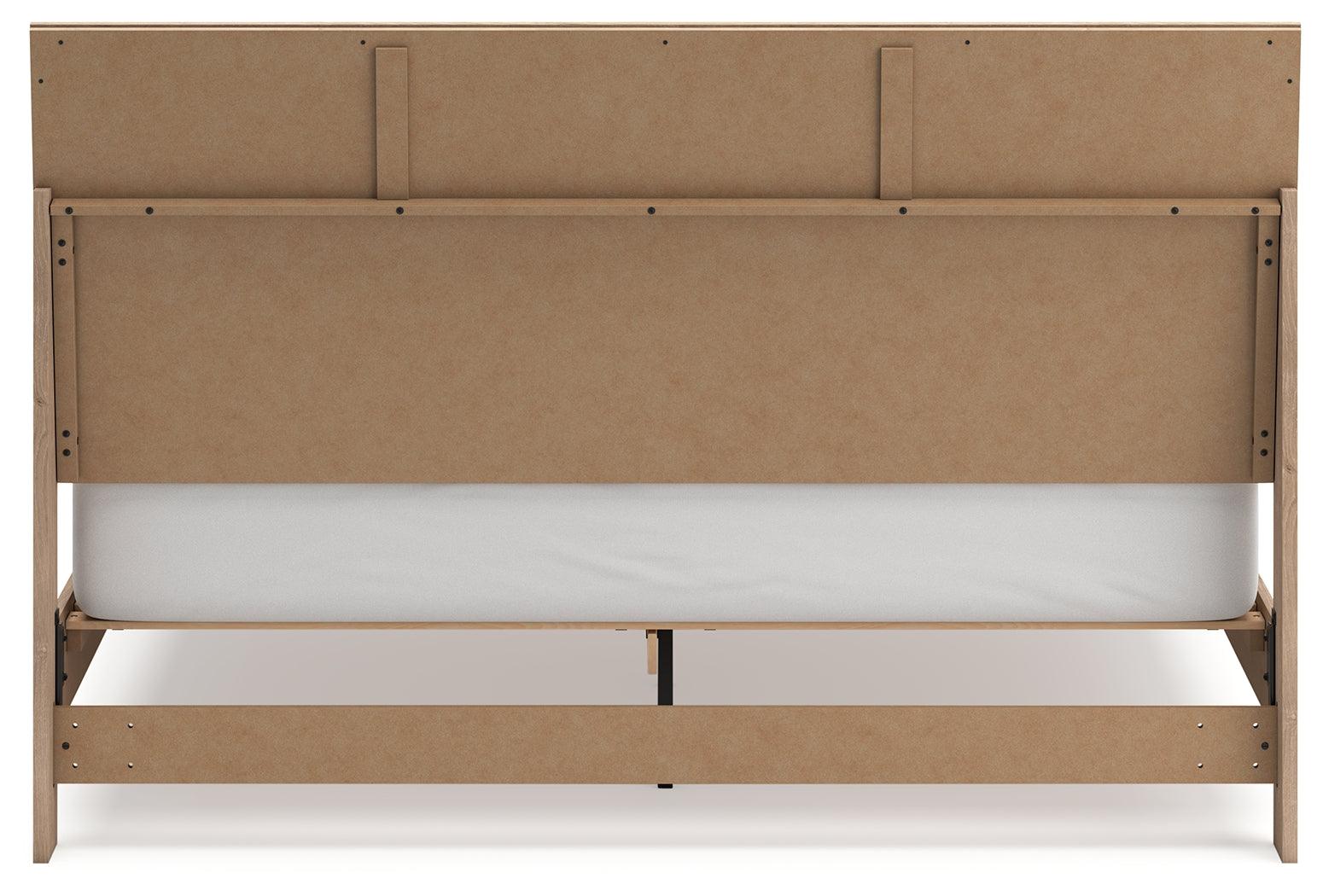 Cielden Two-Tone King Panel Bed angled view in bedroom setting