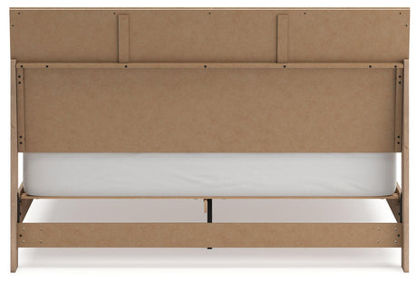 Cielden Two-Tone King Panel Bed angled view in bedroom setting