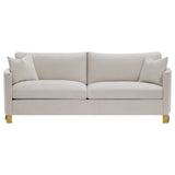 Close-up detail of beige fabric upholstery on Corliss sofa set