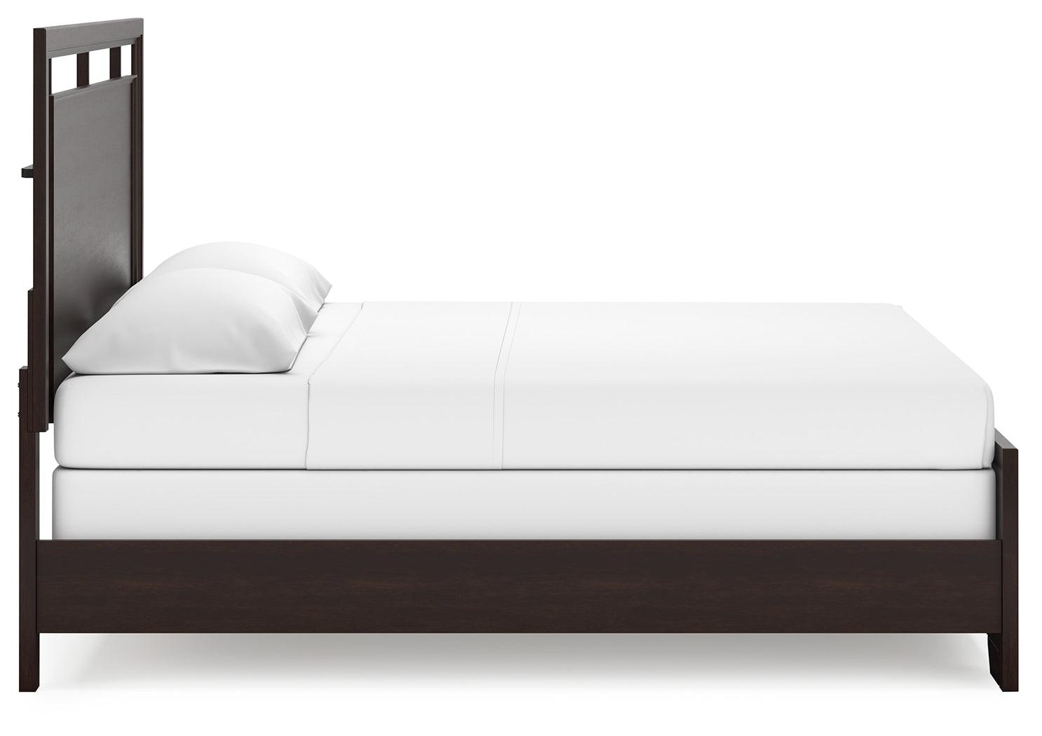 Full view of Covetown Dark Brown King Panel Bed in room setting