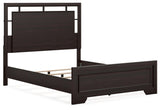 Dark brown queen bed footboard close-up