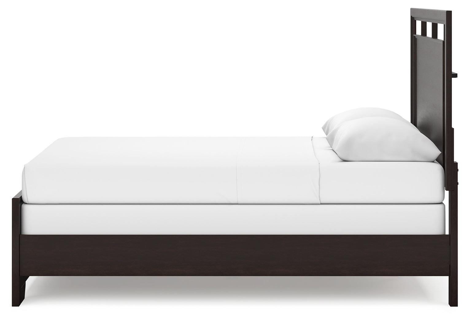 Assembled Covetown queen panel bed in bedroom