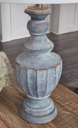 Cylerick Antique Blue Table Lamp lit in room setting
