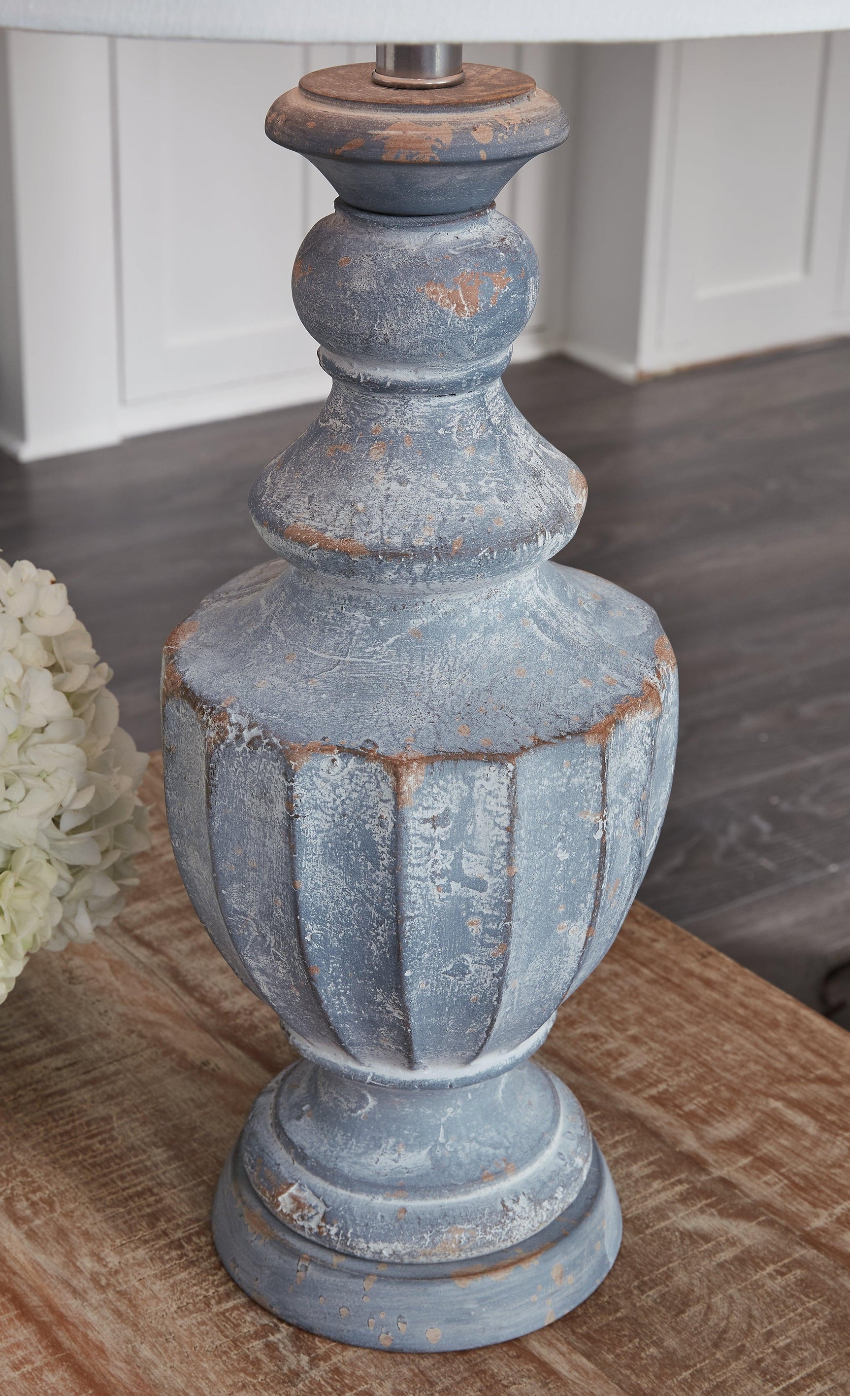 Cylerick Antique Blue Table Lamp lit in room setting