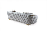 Side angle of loveseat showcasing elegant ivory velvet