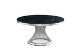 Unico black chrome round dining table angled side view
