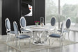 D615 Maxi white marble-like round dining table with chrome legs, angled view