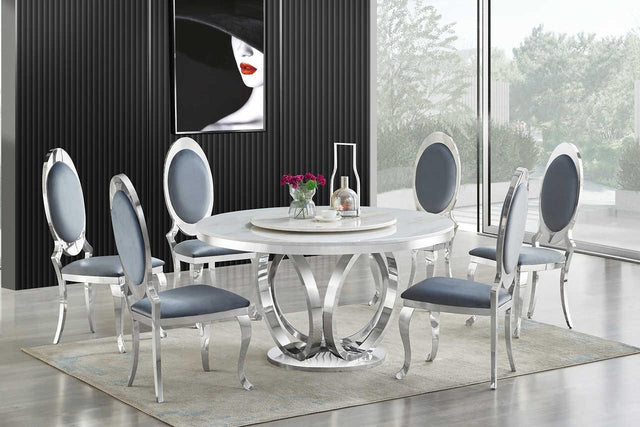 D615 Maxi white marble-like round dining table with chrome legs, angled view