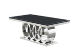Close-up of black marble-like table top and chrome frame
