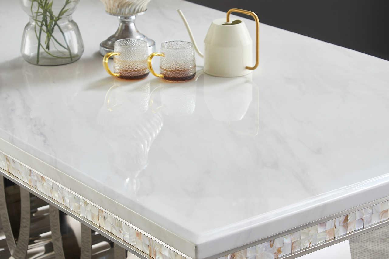Side view of Giovanni dining table showing chrome legs