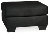 Close-up detail of Darcy Black chair armrest and upholstery