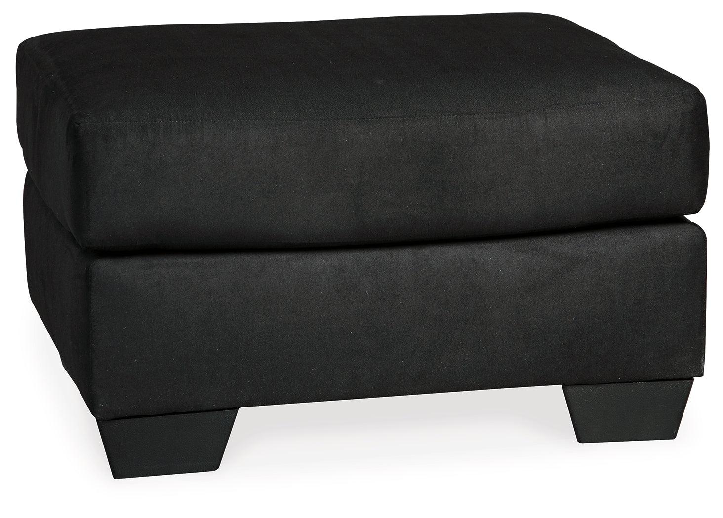 Close-up detail of Darcy Black chair armrest and upholstery