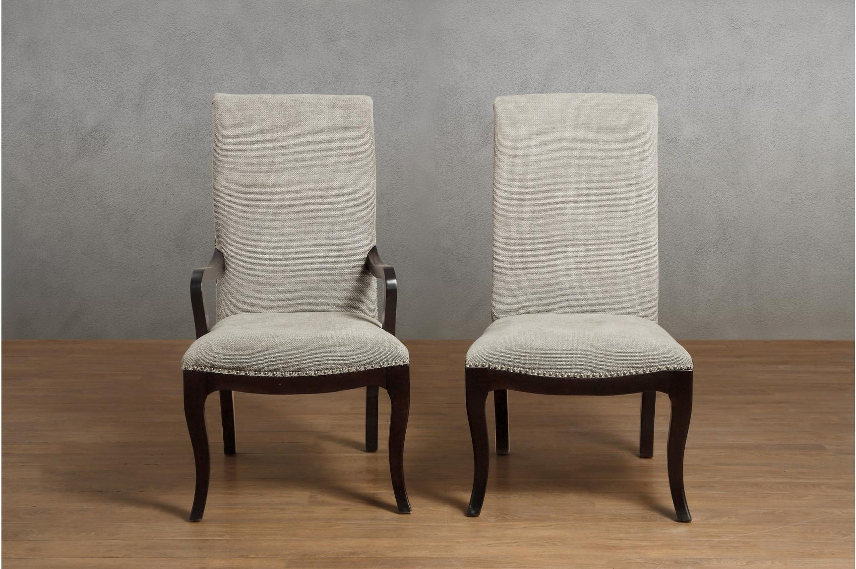 room setting of Savion Neutral Espresso Dining Room Set showing round table and chairs