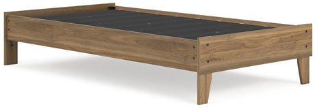 Close-up of honey brown laminate on platform bed