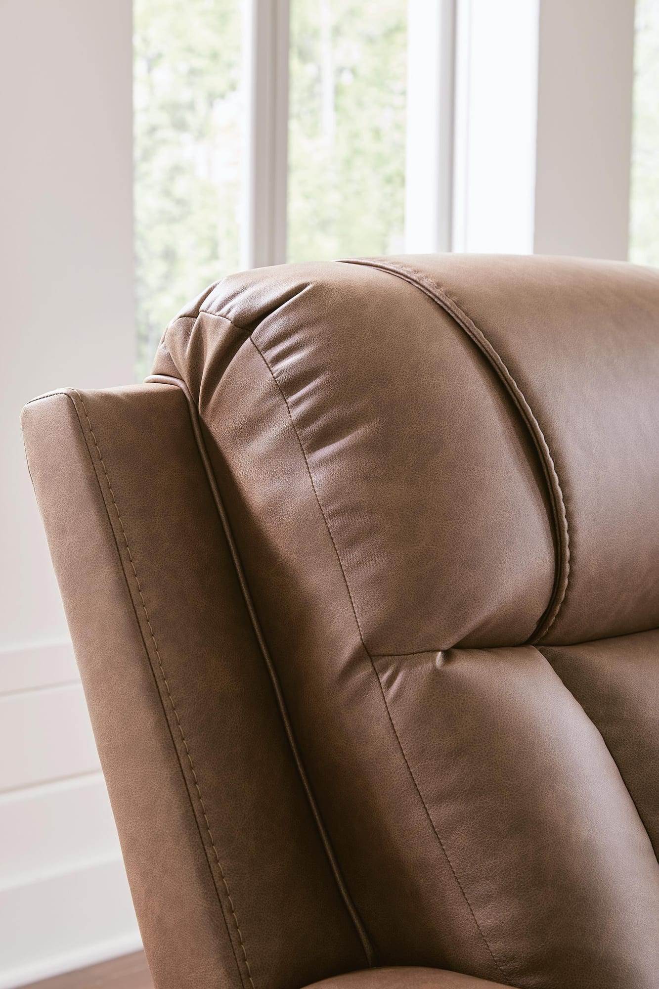 Mackmenville Caramel Faux Leather Reclining Loveseat with Console detail view