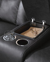 Mackmenville Carbon Faux Leather Reclining Loveseat with Console from Decor Furniture