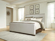 Radkin Burnished Brown Queen Upholstered Panel Bed from Decor Furniture