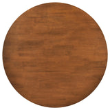 Close-up of walnut finish on Dinah round solid wood dining table