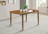 Close-up of walnut finish and tapered leg on Dortch oval dining table