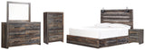 Side view of Drystan Multi Panel 2 Storage Bedroom Set bed