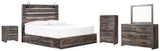 Side view of Drystan Multi Panel 4 Storage Bedroom Set bed