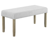 Detail view showing fabric upholstery and wood grain of dining chairs