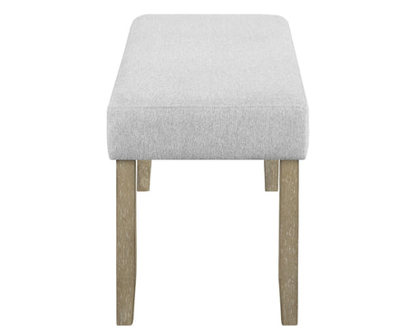Top angle showcasing beige gray fabric upholstered dining table and chairs